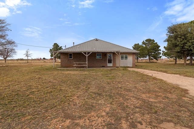 exterior space with a yard and a rural view