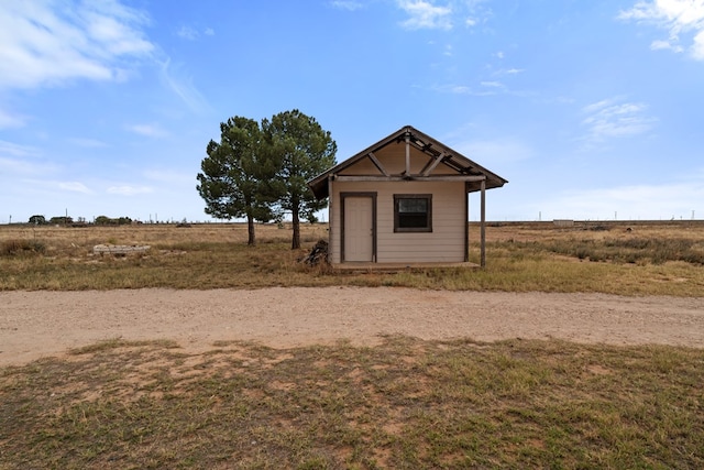 view of outbuilding featuring a rural view