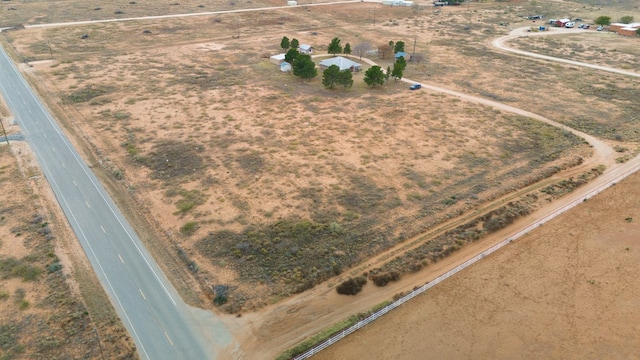 birds eye view of property with a rural view