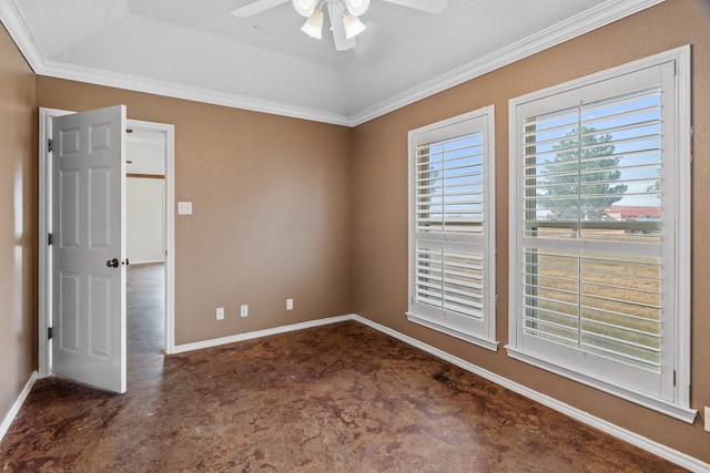 carpeted empty room featuring ceiling fan, ornamental molding, and a textured ceiling