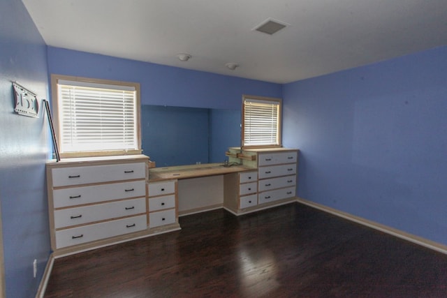 1706 Harvard Ave, Big Spring, TX 79720 - bedroom featuring dark wood-style flooring and baseboards
