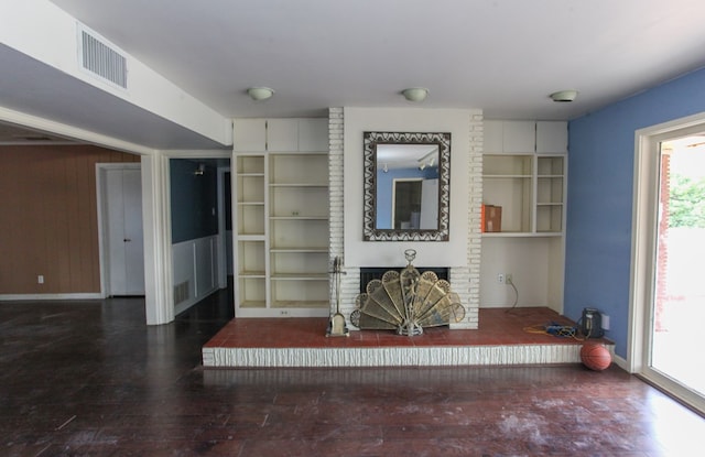 1706 Harvard Ave, Big Spring, TX 79720 - living area with a fireplace, baseboards, and wood finished floors