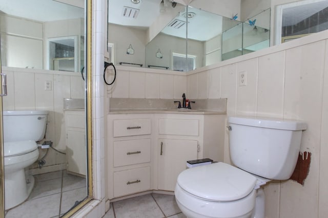 1706 Harvard Ave, Big Spring, TX 79720 - full bath featuring toilet, tile patterned flooring, a stall shower, and vanity