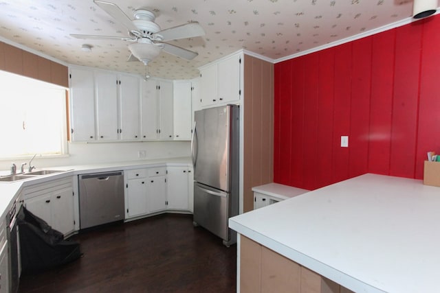 1706 Harvard Ave, Big Spring, TX 79720 - kitchen with appliances with stainless steel finishes, a sink, dark wood finished floors, a ceiling fan, and light countertops
