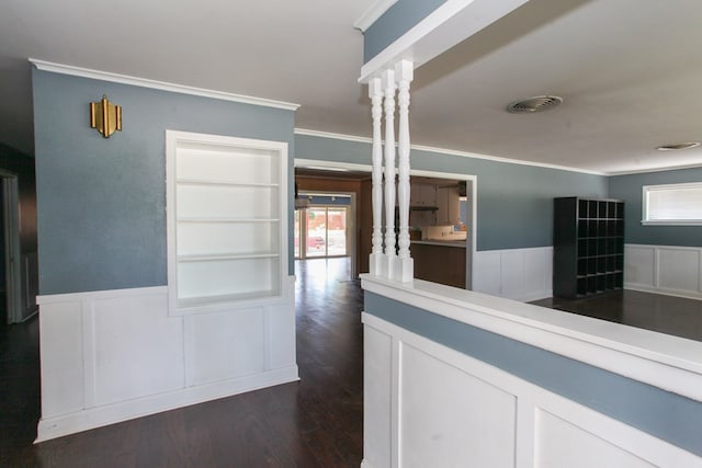 1706 Harvard Ave, Big Spring, TX 79720 - hallway featuring ornamental molding, healthy amount of natural light, wainscoting, dark wood-style floors, and a decorative wall