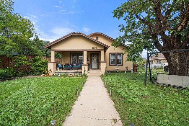 1606 Johnson St, Big Spring, TX 79720 - bungalow-style house featuring covered porch and stucco siding