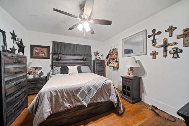 1606 Johnson St, Big Spring, TX 79720 - bedroom with light wood finished floors and ceiling fan
