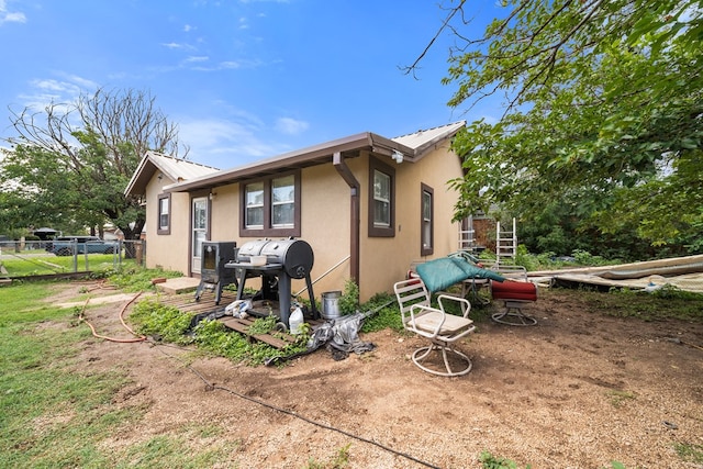1606 Johnson St, Big Spring, TX 79720 - back of property with stucco siding and a metal roof