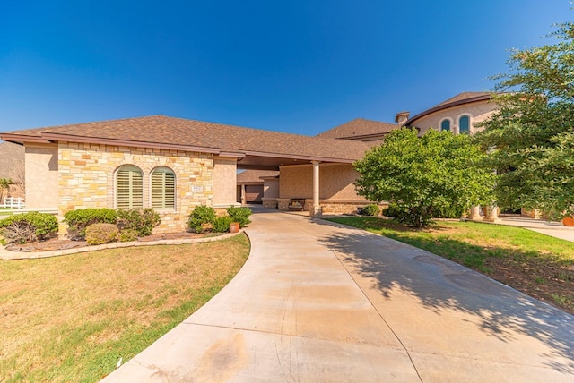 mediterranean / spanish-style house featuring a front yard