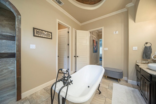 bathroom featuring crown molding, vanity, and a bath