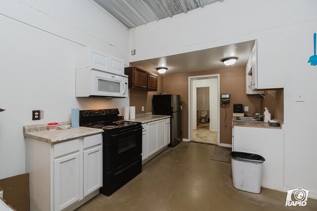 kitchen with sink, white cabinets, and black appliances