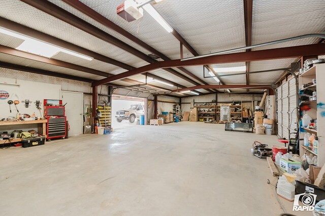 garage featuring a workshop area and a garage door opener