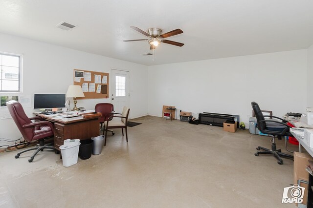 office space featuring a wealth of natural light and ceiling fan