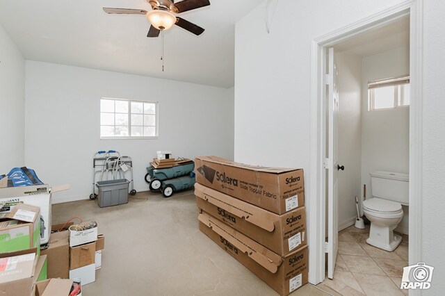 bedroom featuring connected bathroom and ceiling fan