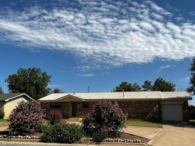 ranch-style house featuring a garage