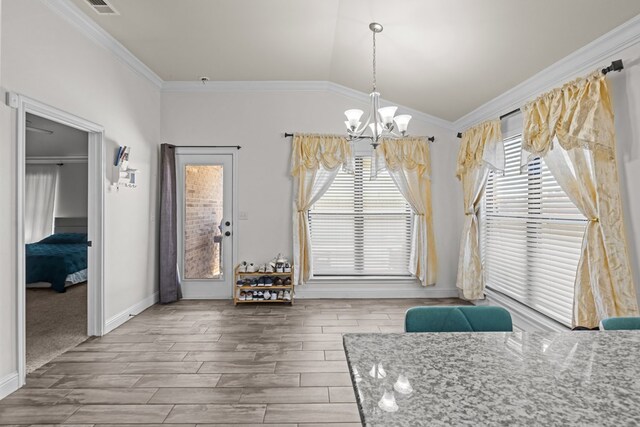 1220 Wrangler Ln, Midland, TX 79705 - dining space with a notable chandelier, vaulted ceiling, crown molding, and wood tiled floor