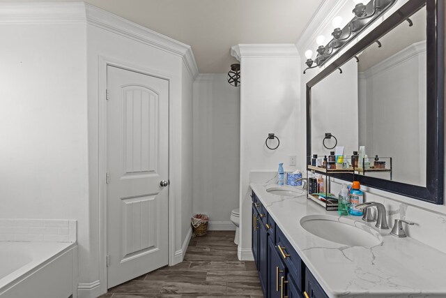 1220 Wrangler Ln, Midland, TX 79705 - bathroom with crown molding, a garden tub, double vanity, and a sink