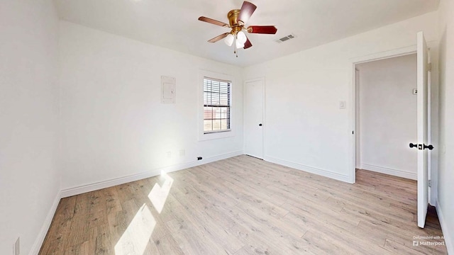 spare room featuring light wood-type flooring and ceiling fan