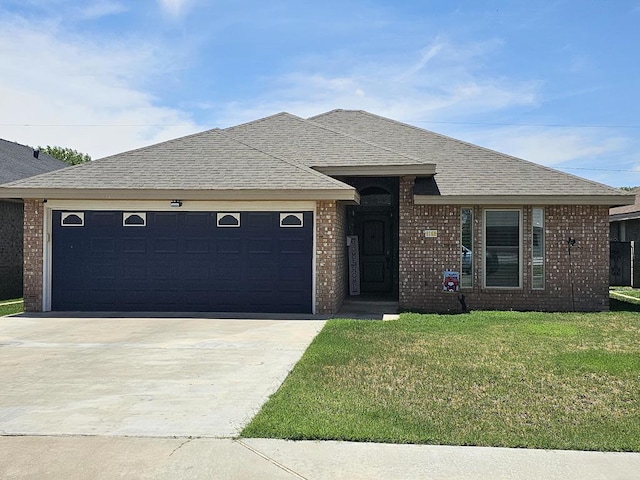 916-B Bronstad Dr, Andrews, TX 79714 - single story home featuring a garage, driveway, a front yard, brick siding, and a shingled roof