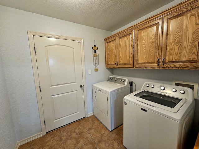 916-B Bronstad Dr, Andrews, TX 79714 - laundry area with cabinet space, washer and clothes dryer, tile patterned floors, and a textured ceiling