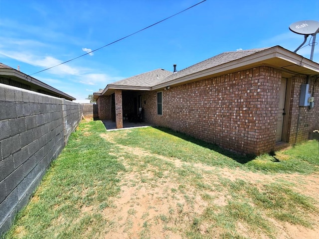 916-B Bronstad Dr, Andrews, TX 79714 - rear view of house featuring brick siding and a patio
