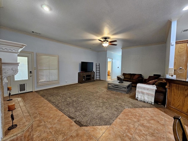 916-B Bronstad Dr, Andrews, TX 79714 - carpeted living room with crown molding, a ceiling fan, a textured ceiling, tile patterned flooring, and recessed lighting