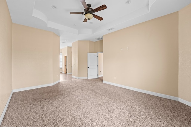 4306 S County Rd 1140, Midland, TX 79706 - unfurnished room featuring a raised ceiling, light colored carpet, a ceiling fan, baseboards, and recessed lighting