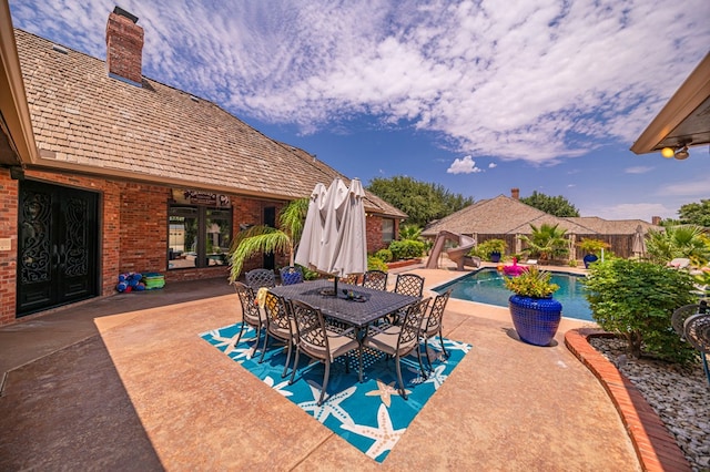 view of swimming pool featuring a patio area