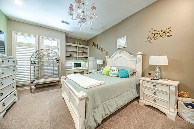 carpeted bedroom featuring a chandelier