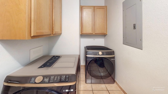 4732 Harvard Ave, Midland, TX 79703 - laundry room featuring cabinet space, electric panel, washing machine and dryer, and light tile patterned floors