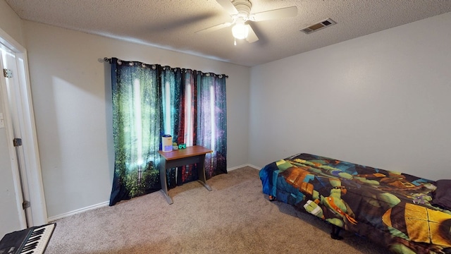 4732 Harvard Ave, Midland, TX 79703 - bedroom with light carpet, a textured ceiling, and ceiling fan