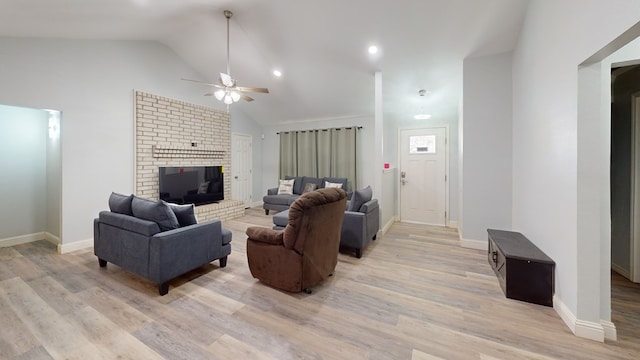 4732 Harvard Ave, Midland, TX 79703 - living room with a ceiling fan, light wood-type flooring, a brick fireplace, vaulted ceiling, and recessed lighting
