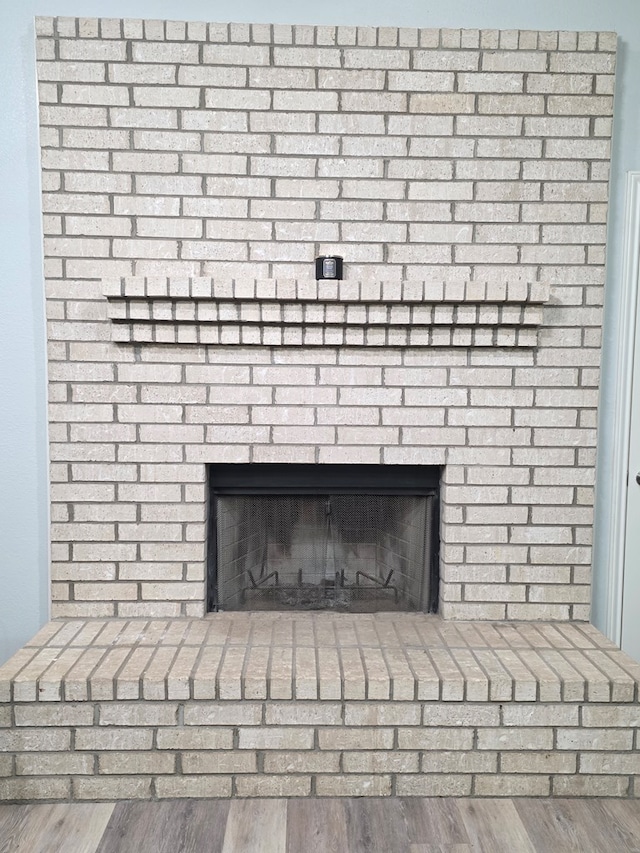 4732 Harvard Ave, Midland, TX 79703 - detailed view of a brick fireplace and wood finished floors