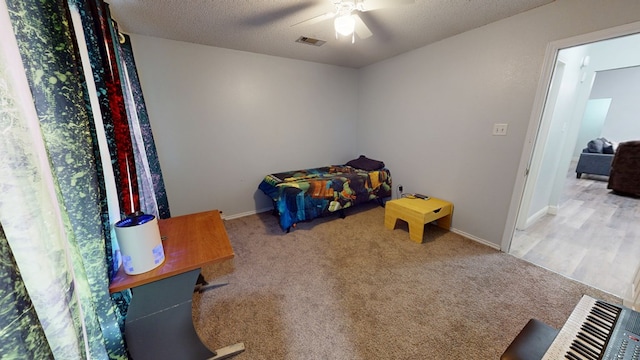4732 Harvard Ave, Midland, TX 79703 - bedroom with carpet flooring, a ceiling fan, baseboards, and a textured ceiling