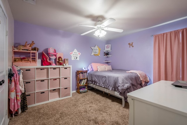bedroom with a ceiling fan and carpet flooring
