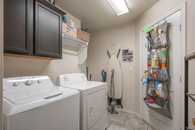 laundry room featuring cabinet space, independent washer and dryer, and baseboards