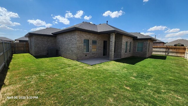 1104 Osprey Dr, Midland, TX 79706 - back of house featuring a patio area, brick siding, a yard, a fenced backyard, and cooling unit