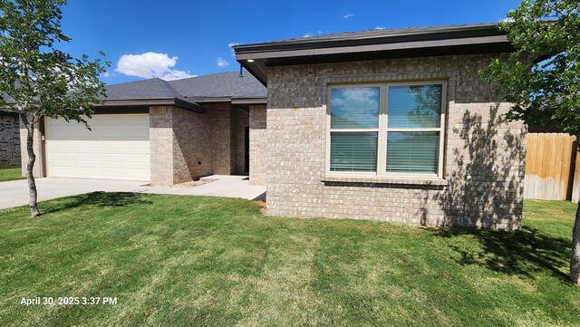 1104 Osprey Dr, Midland, TX 79706 - view of front of house featuring driveway, brick siding, fence, an attached garage, and a front yard
