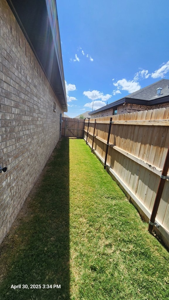 1104 Osprey Dr, Midland, TX 79706 - view of yard with a fenced backyard