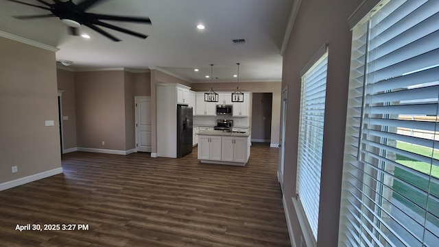 1104 Osprey Dr, Midland, TX 79706 - kitchen with a ceiling fan, visible vents, white cabinetry, crown molding, and appliances with stainless steel finishes