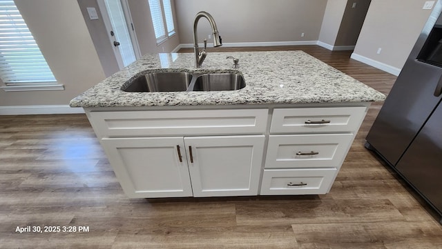1104 Osprey Dr, Midland, TX 79706 - kitchen featuring baseboards, dark wood finished floors, white cabinets, and a sink