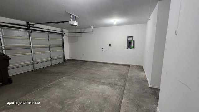 1104 Osprey Dr, Midland, TX 79706 - garage featuring baseboards, electric panel, and a garage door opener