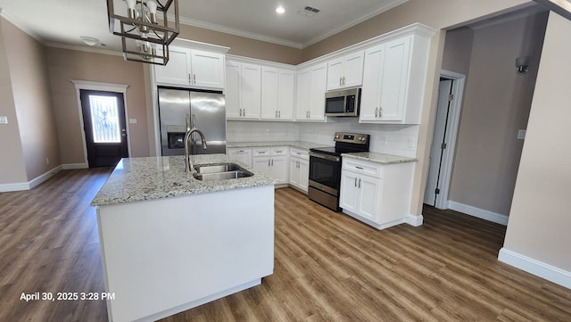 1104 Osprey Dr, Midland, TX 79706 - kitchen featuring a sink, ornamental molding, stainless steel appliances, and visible vents