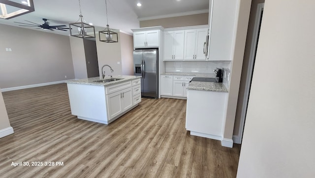 1104 Osprey Dr, Midland, TX 79706 - kitchen featuring light wood finished floors, a ceiling fan, a sink, crown molding, and appliances with stainless steel finishes