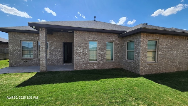1104 Osprey Dr, Midland, TX 79706 - back of property with a yard, brick siding, fence, and a patio area