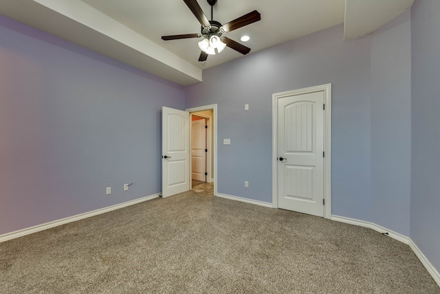 unfurnished bedroom with ceiling fan and carpet floors