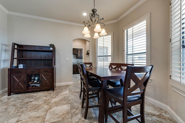 dining space with a chandelier and ornamental molding