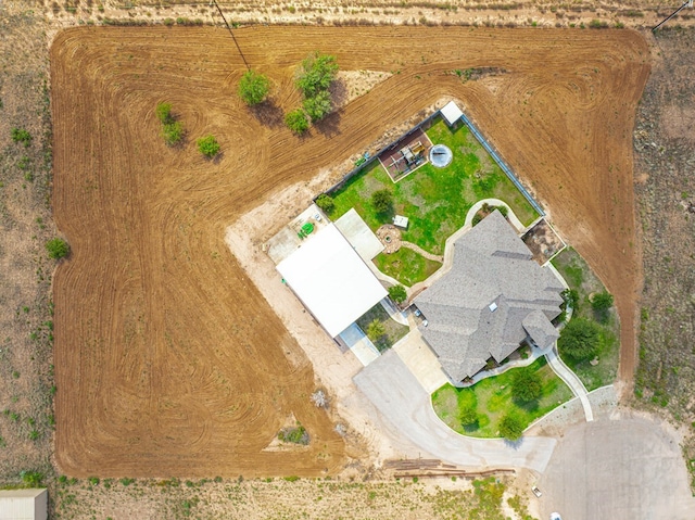 birds eye view of property with a rural view