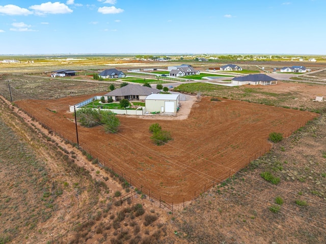 birds eye view of property featuring a rural view