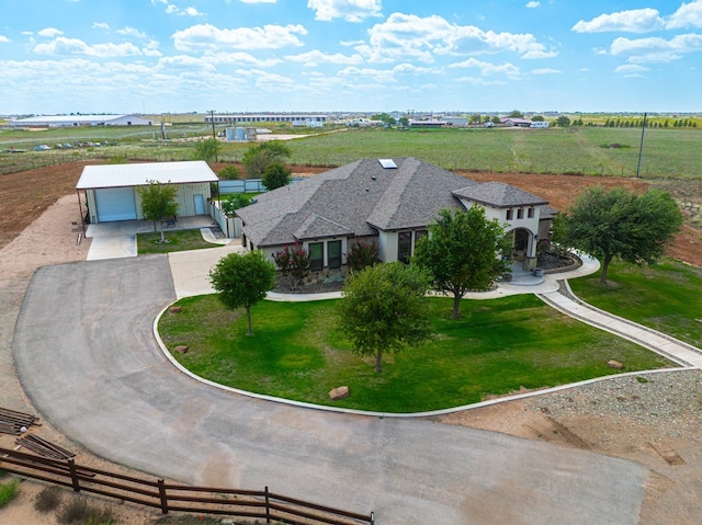 birds eye view of property with a rural view